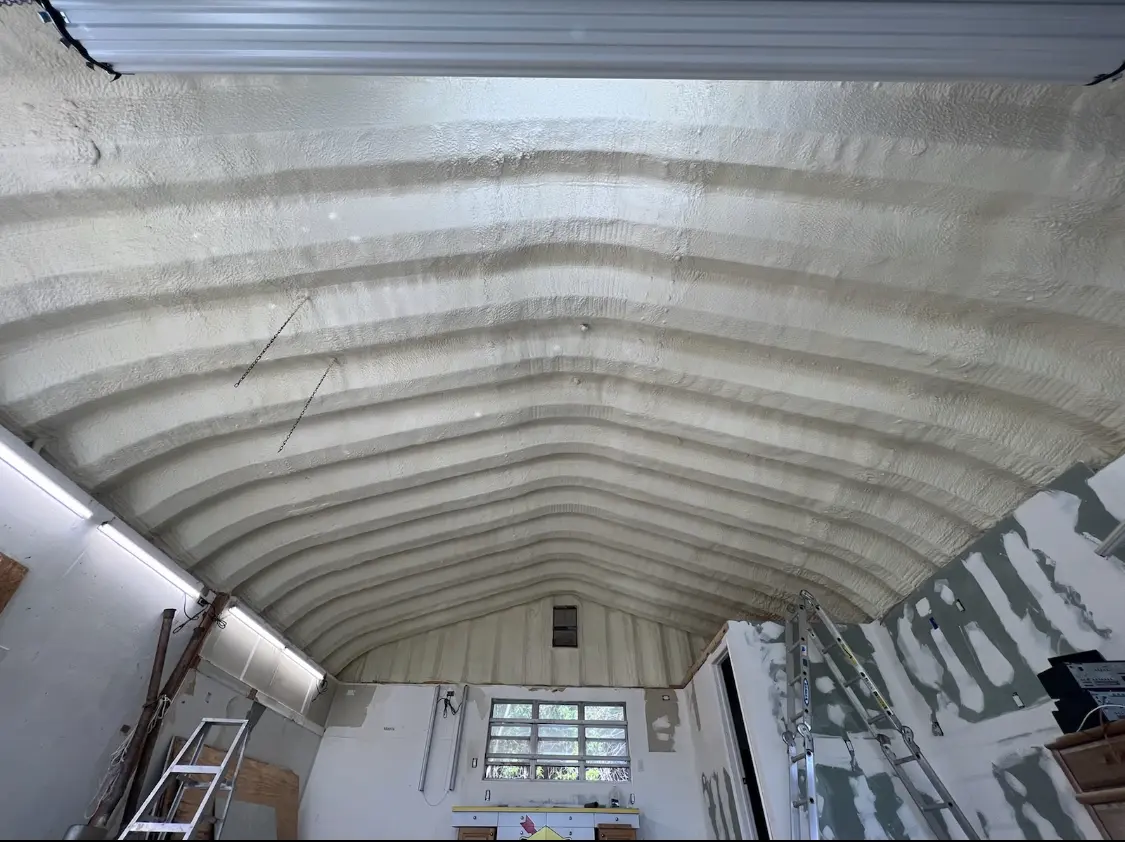 Spray polyurethane foam applied to the underside of a metal roof deck in Minnetonka